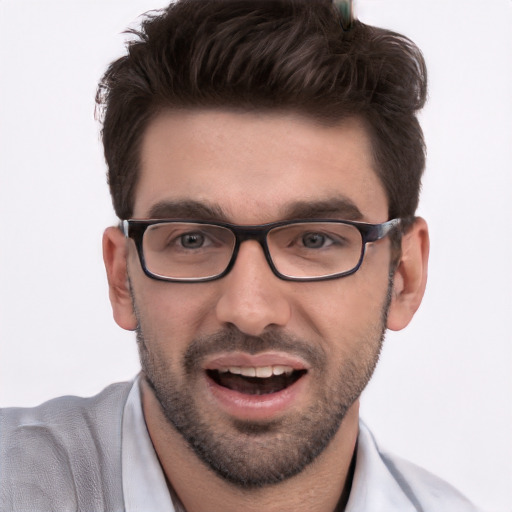 Joyful white young-adult male with short  black hair and brown eyes