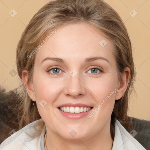 Joyful white young-adult female with medium  brown hair and blue eyes