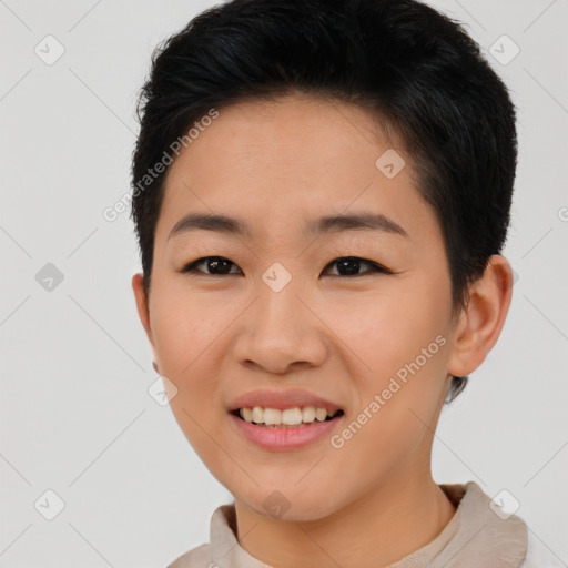 Joyful asian young-adult female with short  brown hair and brown eyes