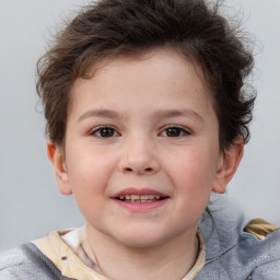 Joyful white child male with short  brown hair and brown eyes