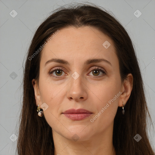 Joyful white adult female with long  brown hair and brown eyes