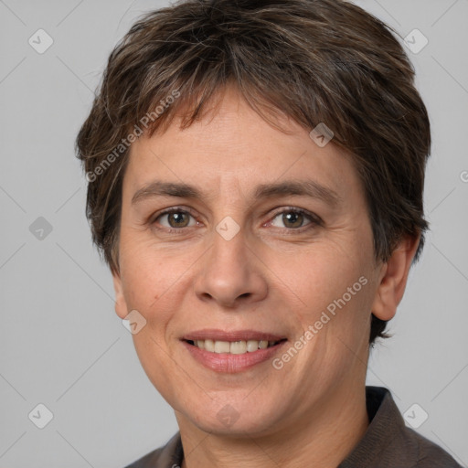 Joyful white adult female with short  brown hair and brown eyes