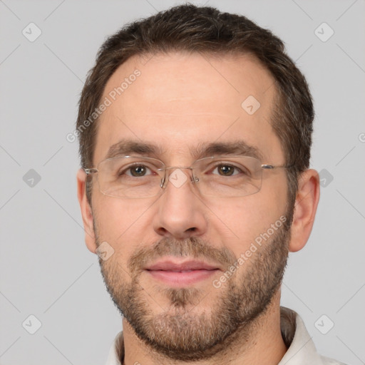 Joyful white adult male with short  brown hair and brown eyes