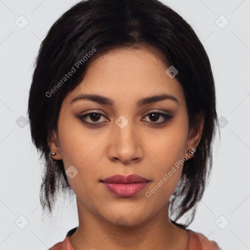 Joyful latino young-adult female with medium  black hair and brown eyes