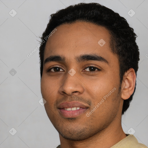 Joyful latino young-adult male with short  black hair and brown eyes