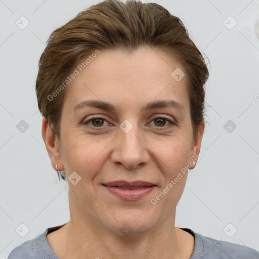 Joyful white adult female with short  brown hair and grey eyes