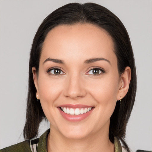 Joyful white young-adult female with medium  brown hair and brown eyes