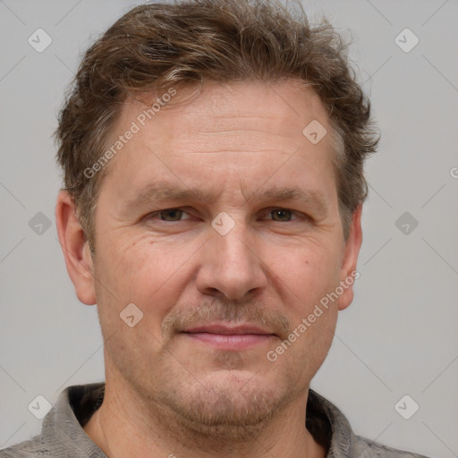 Joyful white adult male with short  brown hair and grey eyes