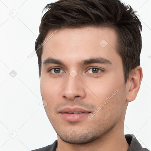 Neutral white young-adult male with short  brown hair and brown eyes