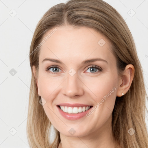 Joyful white young-adult female with long  brown hair and blue eyes