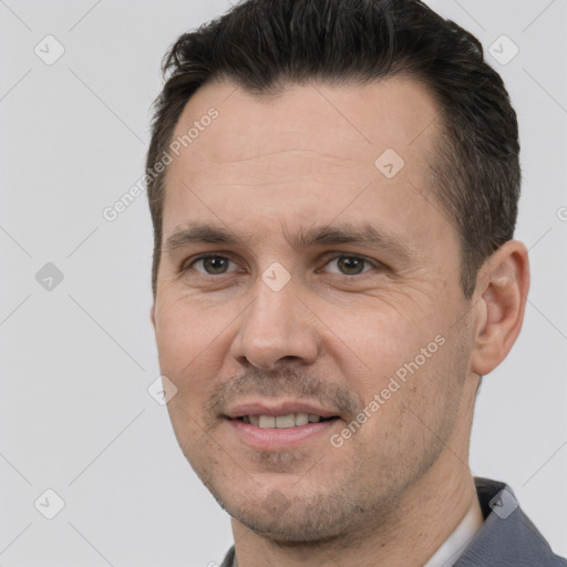 Joyful white adult male with short  brown hair and brown eyes