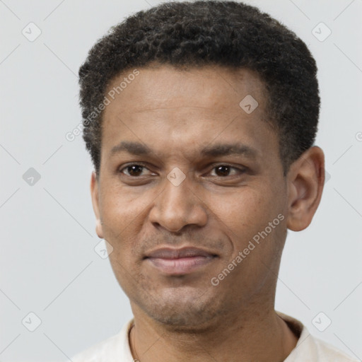 Joyful latino adult male with short  black hair and brown eyes