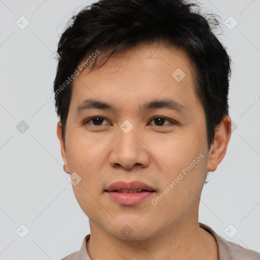 Joyful asian young-adult male with short  brown hair and brown eyes