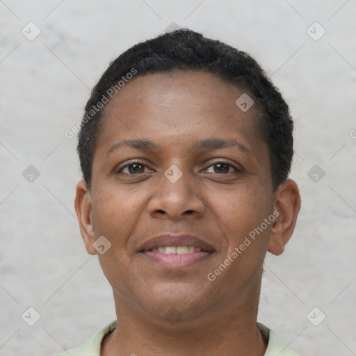 Joyful black young-adult female with short  brown hair and brown eyes