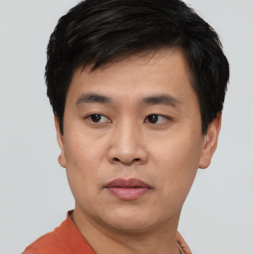 Neutral white young-adult male with short  black hair and brown eyes