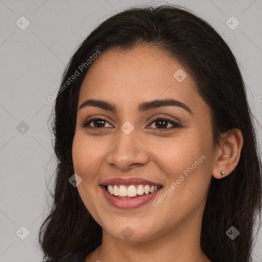 Joyful white young-adult female with long  brown hair and brown eyes