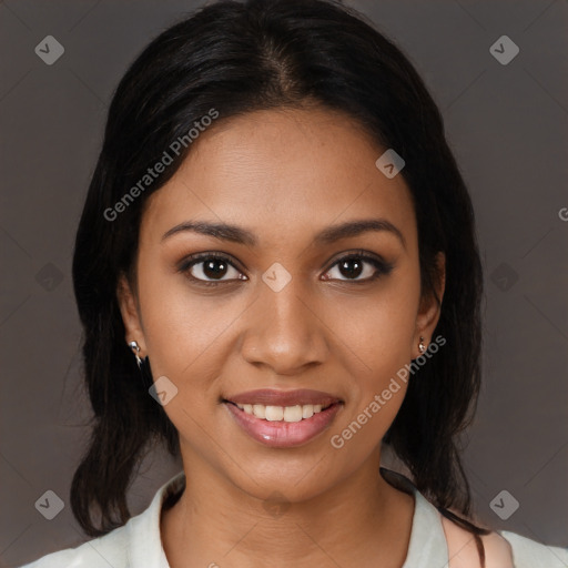 Joyful black young-adult female with medium  black hair and brown eyes