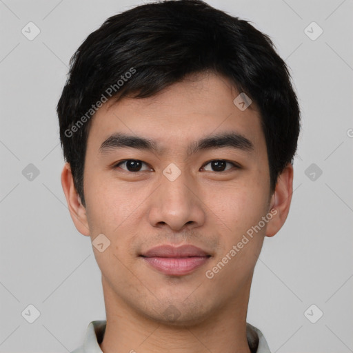 Joyful asian young-adult male with short  black hair and brown eyes