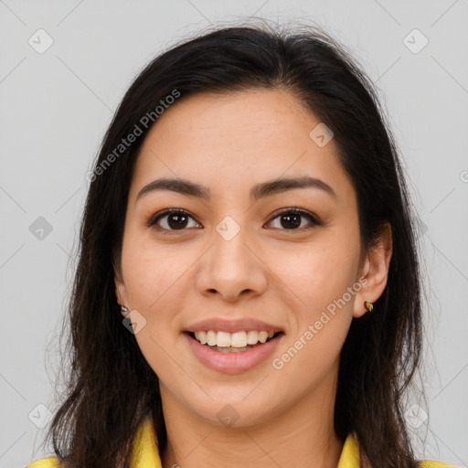 Joyful latino young-adult female with long  brown hair and brown eyes