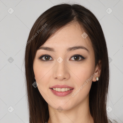 Joyful white young-adult female with long  brown hair and brown eyes