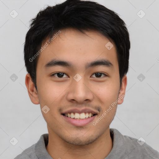 Joyful asian young-adult male with short  brown hair and brown eyes