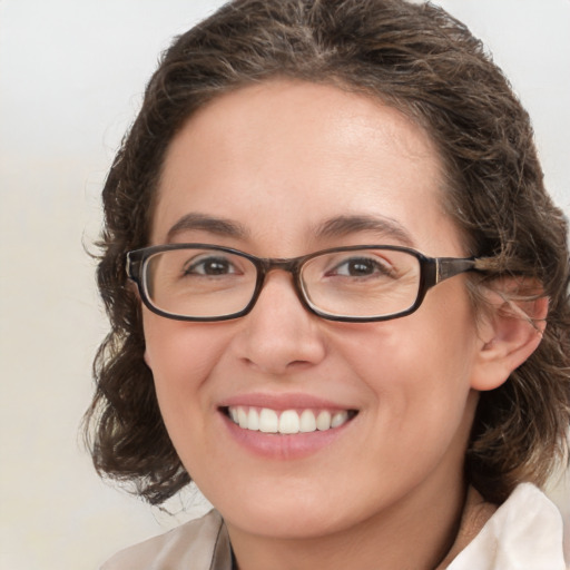 Joyful white young-adult female with medium  brown hair and green eyes