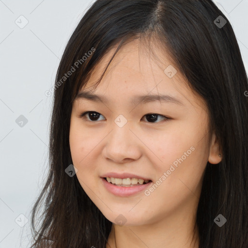 Joyful asian young-adult female with long  brown hair and brown eyes