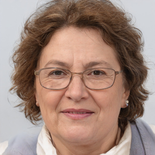 Joyful white middle-aged female with medium  brown hair and brown eyes