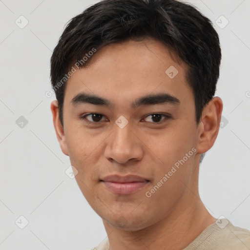 Joyful asian young-adult male with short  black hair and brown eyes