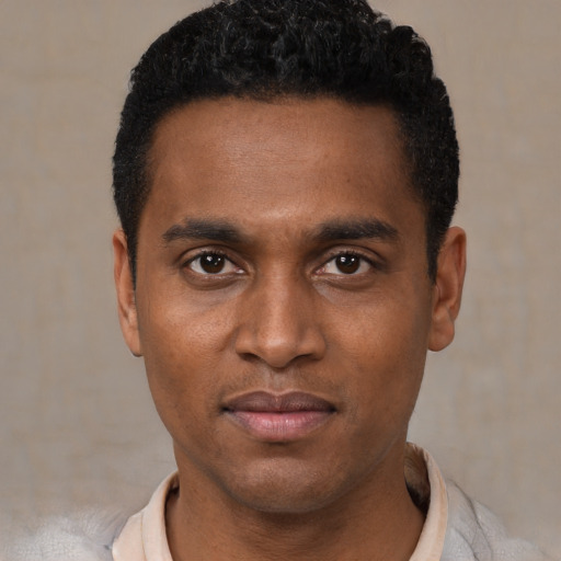 Neutral black young-adult male with short  black hair and brown eyes