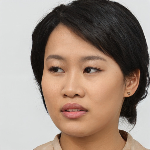Neutral asian young-adult female with medium  black hair and brown eyes