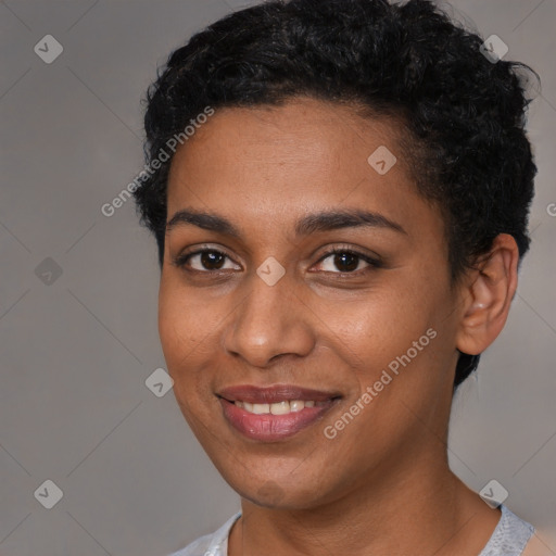 Joyful black young-adult female with short  brown hair and brown eyes