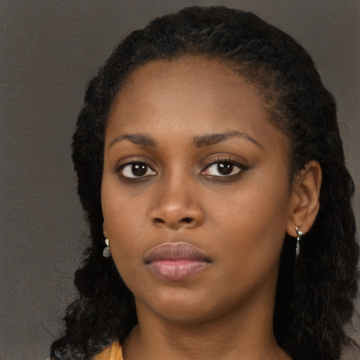 Neutral black young-adult female with long  black hair and brown eyes