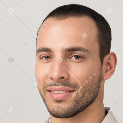 Joyful white young-adult male with short  black hair and brown eyes