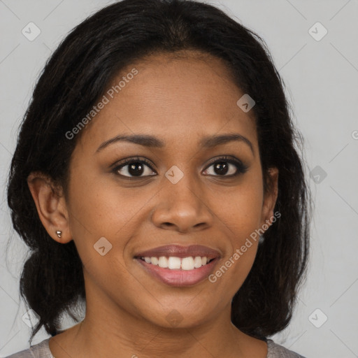 Joyful black young-adult female with medium  brown hair and brown eyes