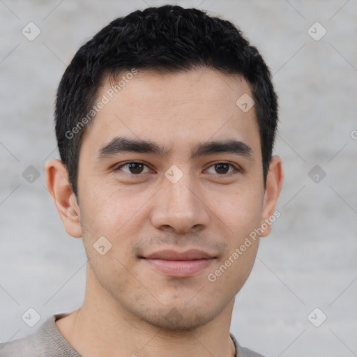 Joyful latino young-adult male with short  brown hair and brown eyes