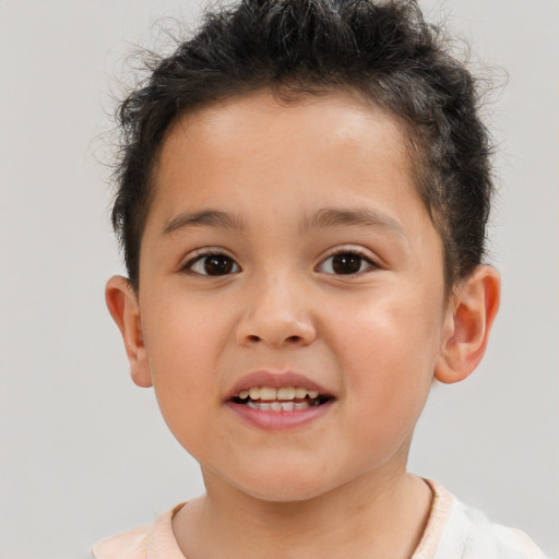 Joyful white child male with short  brown hair and brown eyes