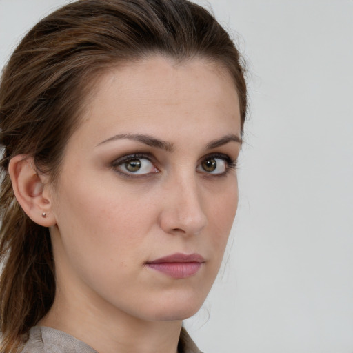 Neutral white young-adult female with long  brown hair and brown eyes