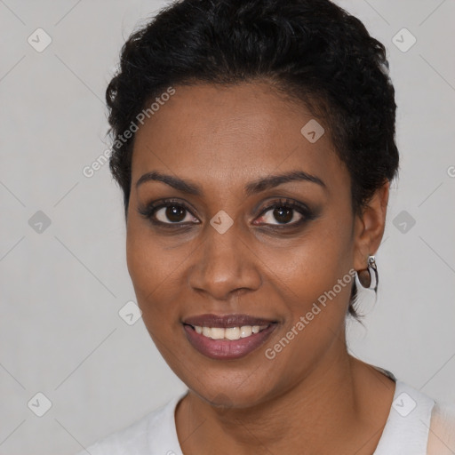 Joyful black young-adult female with short  black hair and brown eyes