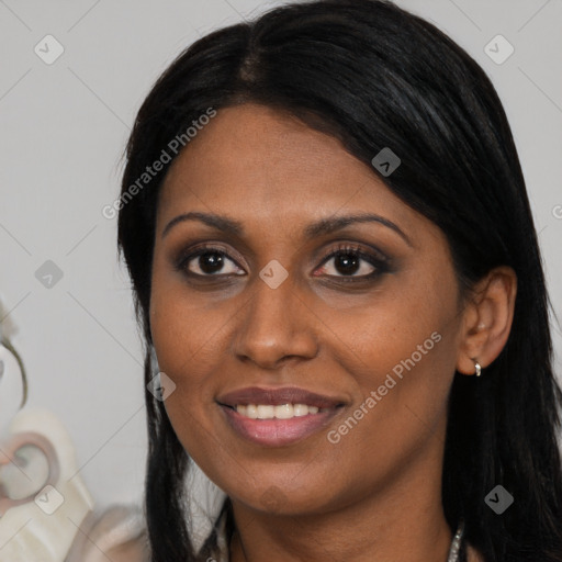 Joyful black adult female with long  black hair and brown eyes