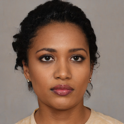 Neutral black young-adult female with short  black hair and brown eyes