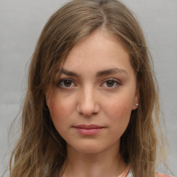 Neutral white young-adult female with long  brown hair and grey eyes