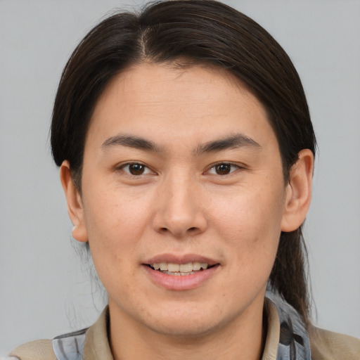 Joyful white young-adult male with medium  brown hair and brown eyes