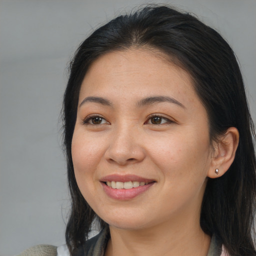 Joyful asian young-adult female with medium  brown hair and brown eyes