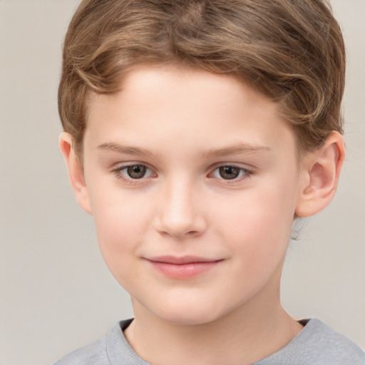 Joyful white child male with short  brown hair and brown eyes