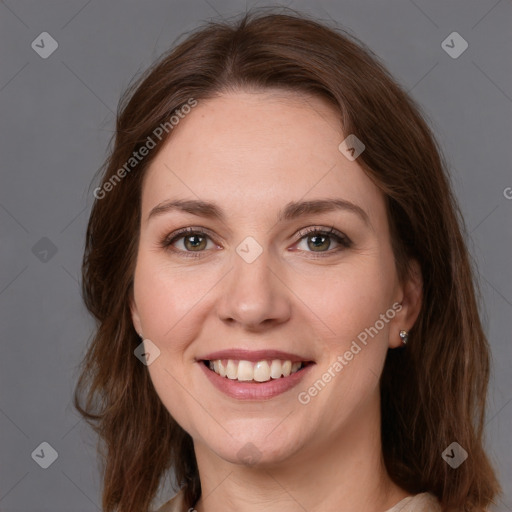 Joyful white young-adult female with medium  brown hair and green eyes