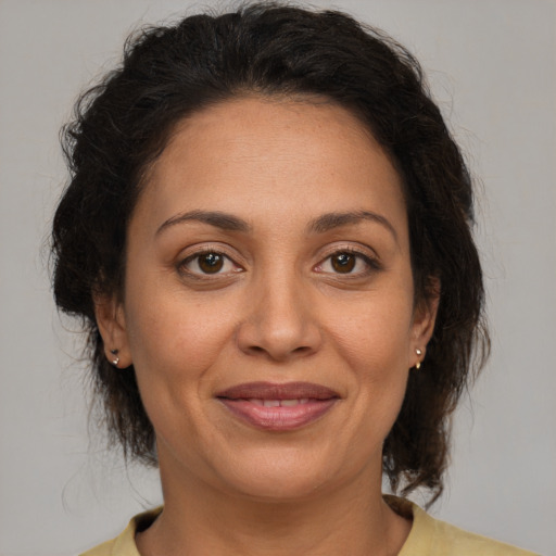 Joyful white adult female with medium  brown hair and brown eyes