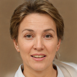 Joyful white adult female with short  brown hair and brown eyes