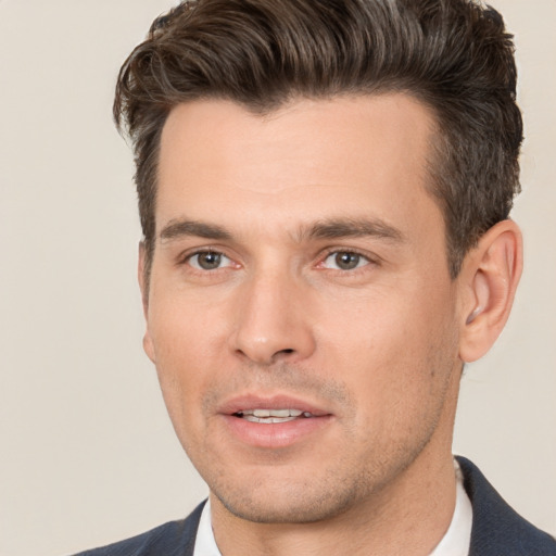 Joyful white adult male with short  brown hair and brown eyes