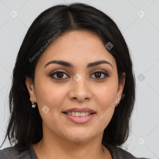 Joyful latino young-adult female with long  brown hair and brown eyes